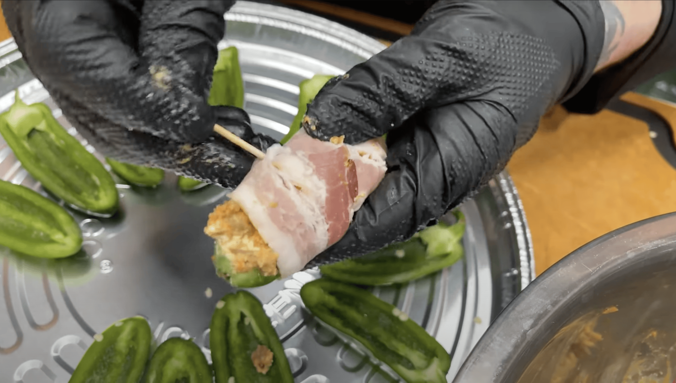 Bacon wrapped around Jalapeño pepper