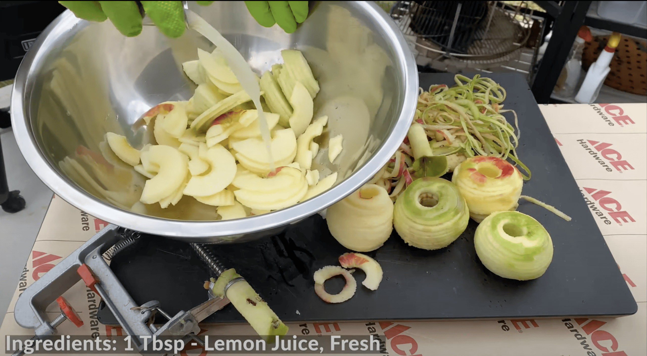 Sliced apples in a bowl with lemon juice