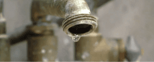 A drip of water from an exterior spigot