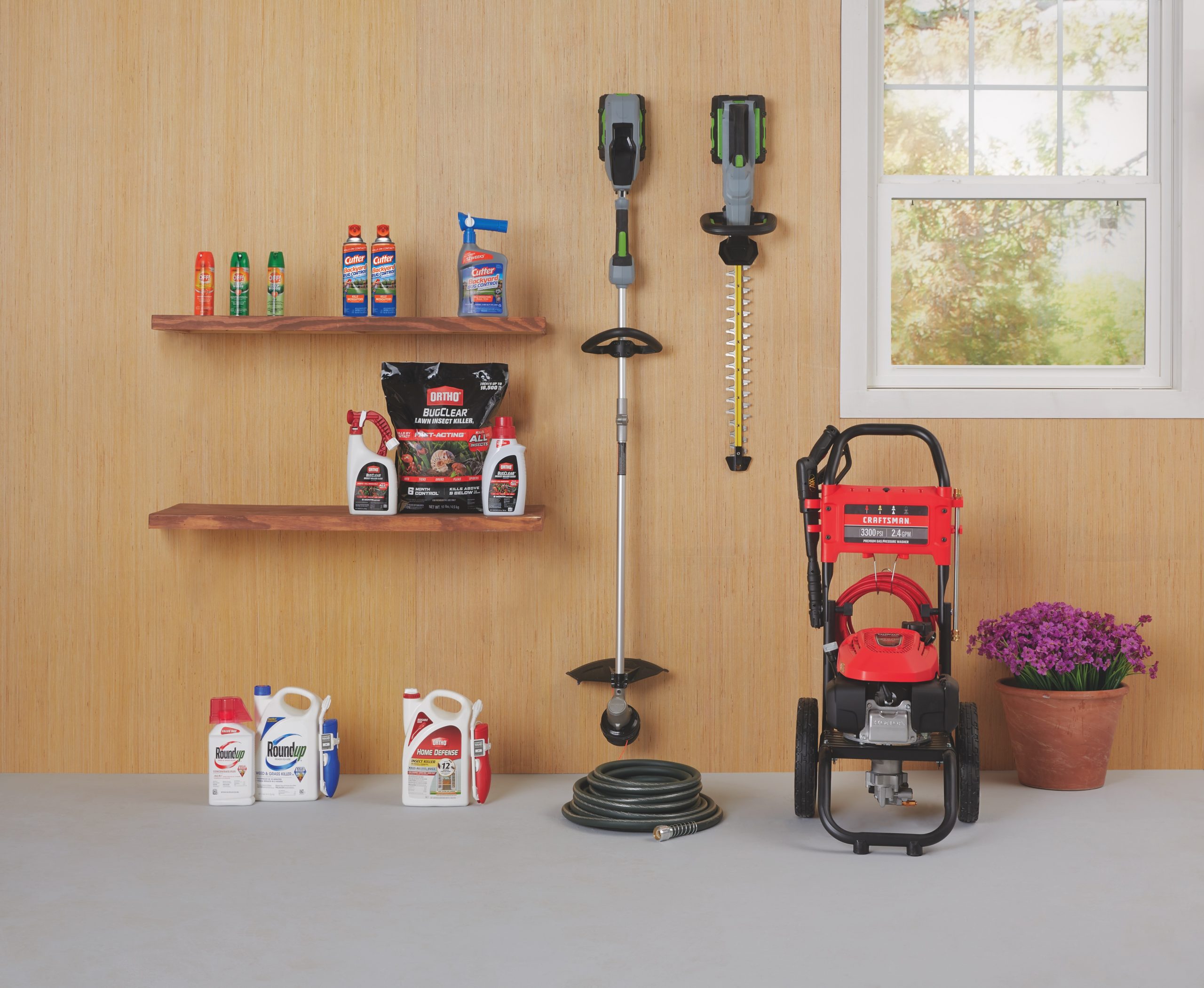 Garage with common outdoor products along the wall.